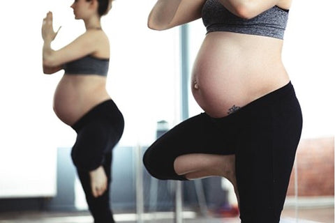 Pregnant woman practicing yoga