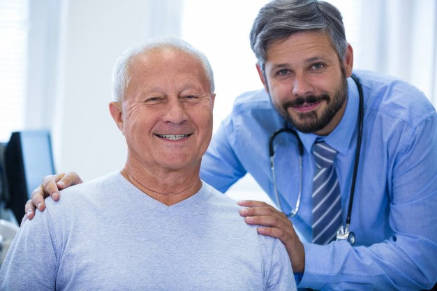 Doctor and patient smiling.